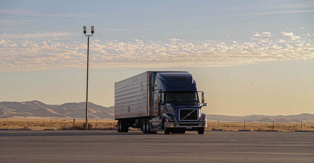 Commercial Tractor-Trailer Fleet Staged at Carrier Terminal under FMCSA Safety Compliance