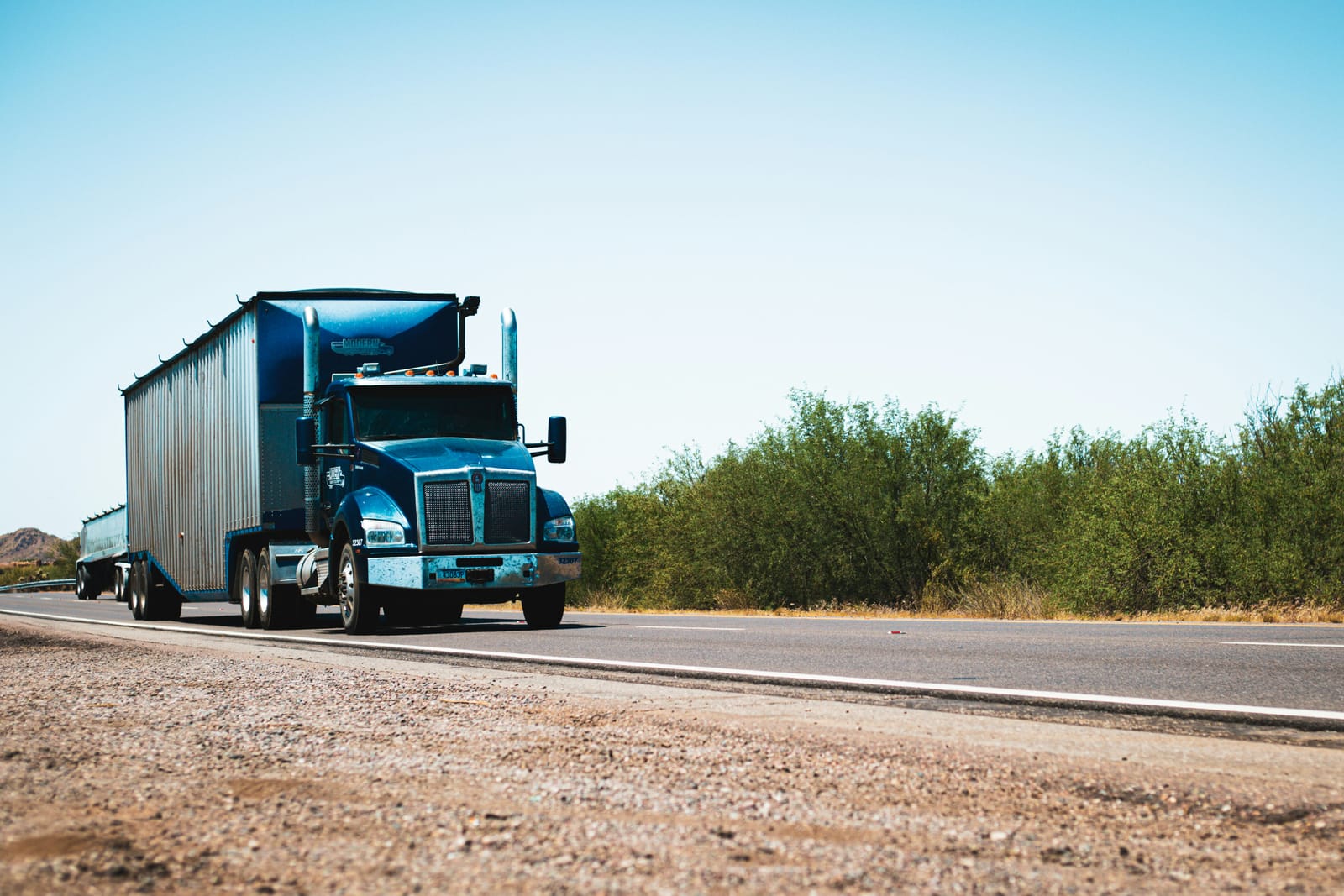 Blue semi-truck on a US highway