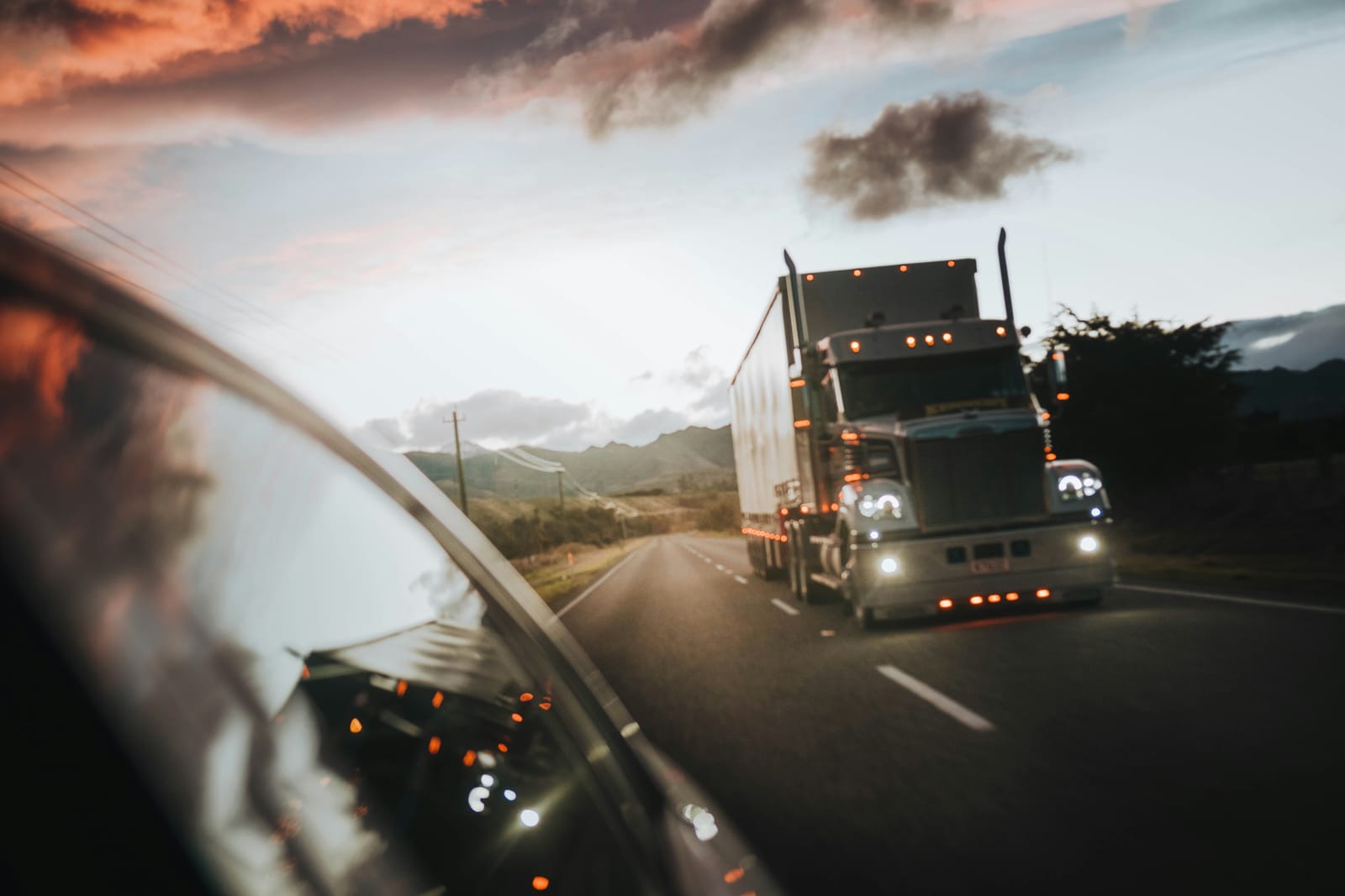 Semi-truck at dusk on the highway