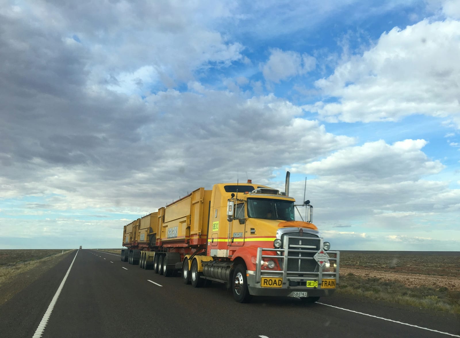 Long-haul truck hauling multiple trailers