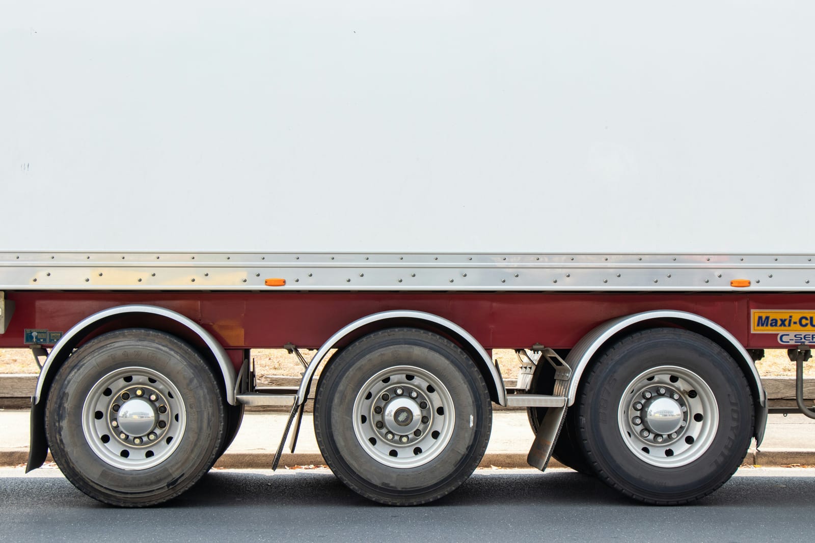 Close view of a semi-truck trailer wheels